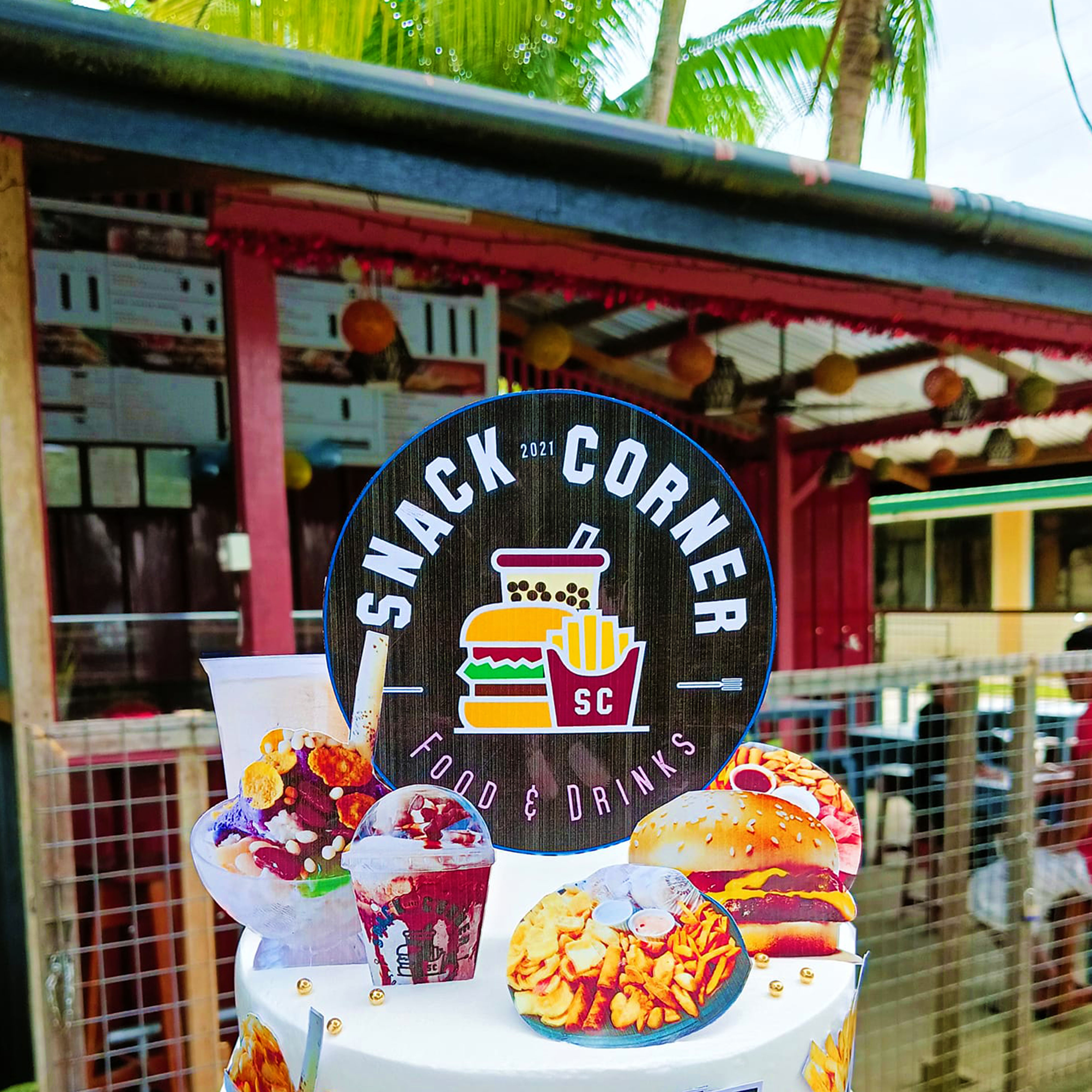 <b class="font-bara"><i class="bi bi-geo-fill h4"></i> SNACK CORNER</b> <br/>Located at P-5 Brgy. Oteiza, San Agustin, Surigao del Sur near San Agustin Municipal Hall. Come and order your favorite snack at Snack Corner!